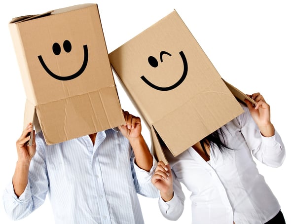 Couple of cardbord characters with smiley faces - isolated over a white background.jpeg
